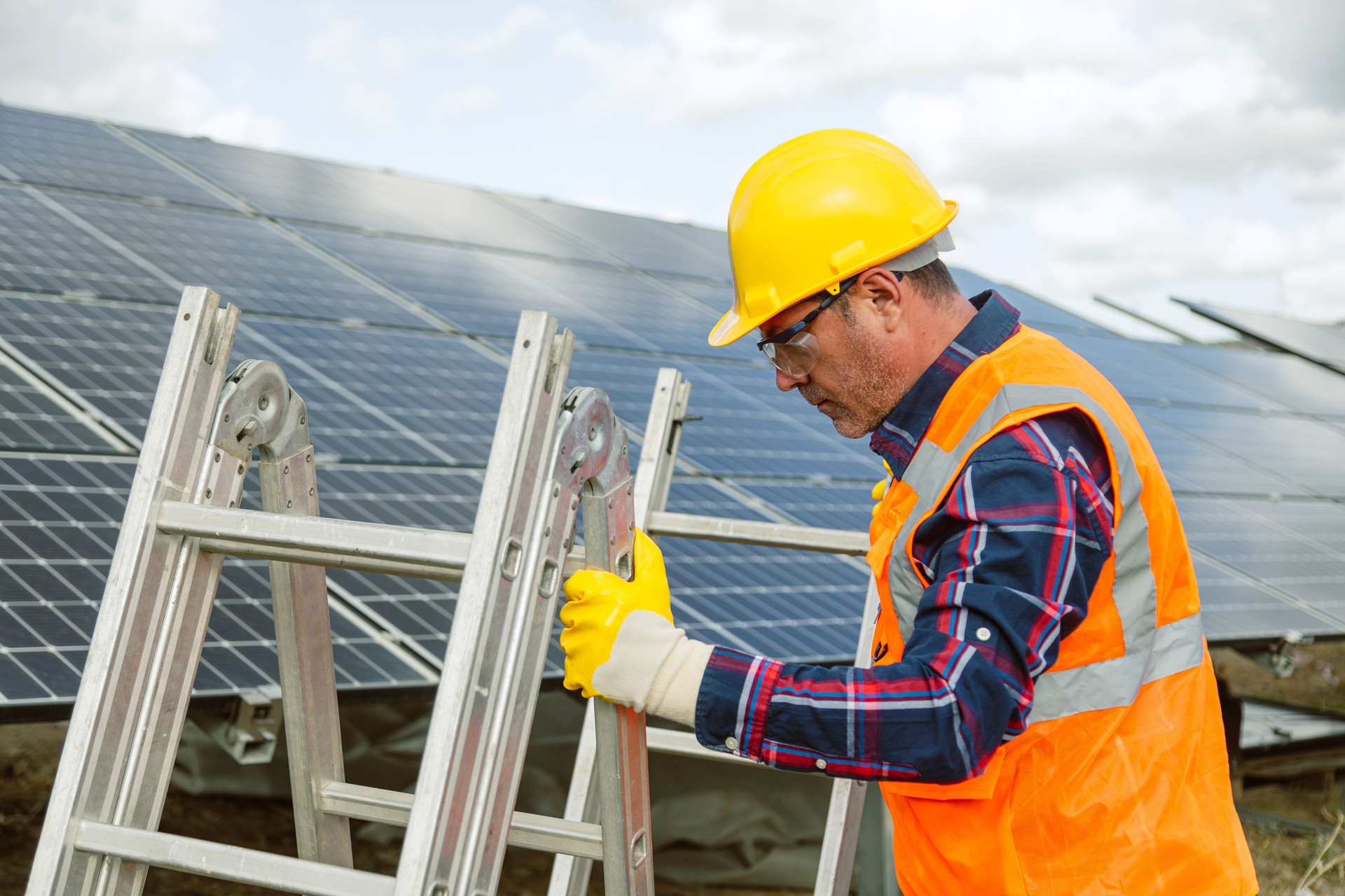 Professional electrician mounting solar module